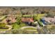Aerial view of beautiful homes with well-manicured lawns and lush landscaping at 1008 Royal Birkdale Dr, Tarpon Springs, FL 34688