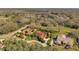 Expansive aerial view of a suburban neighborhood with well-maintained homes, lush landscaping, and mature trees at 1008 Royal Birkdale Dr, Tarpon Springs, FL 34688