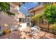 Brick back patio with white metal seating, offers great natural light and space at 1008 Royal Birkdale Dr, Tarpon Springs, FL 34688