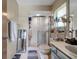 Clean bathroom with a glass shower, vanity, and window, providing a well-maintained and functional space at 1008 Royal Birkdale Dr, Tarpon Springs, FL 34688