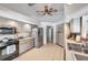 Functional kitchen featuring neutral-toned cabinetry, stainless steel appliances, and ample countertop space at 1008 Royal Birkdale Dr, Tarpon Springs, FL 34688
