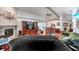 Expansive living room featuring a fireplace, vaulted ceilings, wood floors, and an open floor plan at 1008 Royal Birkdale Dr, Tarpon Springs, FL 34688