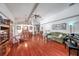 Expansive living area with dining set, grand piano, comfortable seating, and seamless flow for modern living at 1008 Royal Birkdale Dr, Tarpon Springs, FL 34688