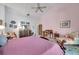 Bright main bedroom featuring vaulted ceilings and ample closet space at 1008 Royal Birkdale Dr, Tarpon Springs, FL 34688