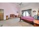 Cozy main bedroom featuring vaulted ceilings and a sitting area at 1008 Royal Birkdale Dr, Tarpon Springs, FL 34688