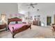 Large main bedroom with vaulted ceilings and traditional furnishings at 1008 Royal Birkdale Dr, Tarpon Springs, FL 34688
