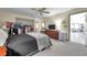 Spacious main bedroom with a closet, soft carpet, and access to dinning area providing a serene retreat at 1008 Royal Birkdale Dr, Tarpon Springs, FL 34688