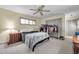 Comfortable bedroom with neutral color scheme, ceiling fan, and closet offering a relaxing retreat at 1008 Royal Birkdale Dr, Tarpon Springs, FL 34688