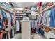 Walk-in closet with shelving and lots of space to store clothes at 1008 Royal Birkdale Dr, Tarpon Springs, FL 34688
