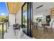 View of the modern outdoor balcony with black metal railings and contemporary seating, connected to the dining area at 101 W Warren Ave # 1, Tampa, FL 33602