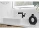 Modern bathroom sink with matte black faucet and decor at 101 W Warren Ave # 1, Tampa, FL 33602