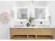 Modern bathroom with dual sinks, wood vanity, decorative mirrors, and stylish decor at 101 W Warren Ave # 1, Tampa, FL 33602