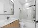 Modern bathroom with sleek vanity, black fixtures, and tiled shower with glass door at 101 W Warren Ave # 1, Tampa, FL 33602