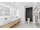 Contemporary bathroom featuring double sinks, a walk-in shower, and stylish fixtures at 101 W Warren Ave # 1, Tampa, FL 33602