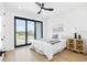 Bedroom featuring a large sliding glass door with a view, ceiling fan, and light wood flooring at 101 W Warren Ave # 1, Tampa, FL 33602