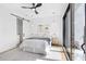 Sunlit bedroom featuring an ensuite bathroom, walk-in closet, and balcony access at 101 W Warren Ave # 1, Tampa, FL 33602