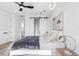 Stylishly decorated bedroom features a ceiling fan, closet with sliding barn door, and modern lighting at 101 W Warren Ave # 1, Tampa, FL 33602
