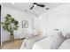 Bright bedroom with a modern ceiling fan, closet, ensuite, and neutral decor at 101 W Warren Ave # 1, Tampa, FL 33602