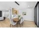 Well-lit dining area with stylish furniture, next to a kitchenette and view of the staircase at 101 W Warren Ave # 1, Tampa, FL 33602