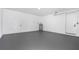 Clean and bright garage with a gray epoxy floor and plenty of storage space at 101 W Warren Ave # 1, Tampa, FL 33602