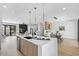 Open floor plan featuring a large island with seating, seamlessly connecting the kitchen, dining, and living areas at 101 W Warren Ave # 1, Tampa, FL 33602