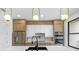 Modern kitchen featuring a large island, stainless steel appliances, and stylish pendant lighting at 101 W Warren Ave # 1, Tampa, FL 33602