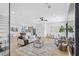 Open-concept living room featuring a view of the kitchen, modern furnishings, and ample natural light at 101 W Warren Ave # 1, Tampa, FL 33602