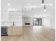 Open-concept living room with a wet bar, modern fireplace, and hardwood floors at 101 W Warren Ave # 1, Tampa, FL 33602