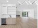 Bright, open living space with a modern fireplace, custom bar, and beverage fridge, perfect for entertaining at 101 W Warren Ave # 1, Tampa, FL 33602