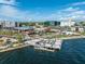 Waterfront pier with people enjoying the scenery, surrounded by buildings, shops, and restaurants at 101 W Warren Ave # 1, Tampa, FL 33602