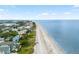 Panoramic aerial view of waterfront neighborhood with direct beach access and ocean views at 11722 Currie Ln # G1, Largo, FL 33774