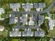 This aerial view showcases a neighborhood with a refreshing communal swimming pool at 11722 Currie Ln # G1, Largo, FL 33774