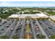 Expansive aerial view showcases property nearby an assortment of local stores and convenient parking at 11722 Currie Ln # G1, Largo, FL 33774