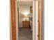 Bedroom features a closet, a nightstand and a lamp at 11722 Currie Ln # G1, Largo, FL 33774