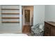 Bedroom featuring a cozy chair and easy access to the en suite bathroom at 11722 Currie Ln # G1, Largo, FL 33774