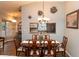 Lovely dining room with wood table, chairs, and decorative lighting at 11722 Currie Ln # G1, Largo, FL 33774