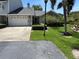 Traditional home with a two-car garage, beautiful landscaping and an inviting front entrance at 11722 Currie Ln # G1, Largo, FL 33774