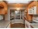 Bright kitchen featuring a garden window and sleek appliances at 11722 Currie Ln # G1, Largo, FL 33774