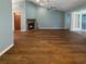 Spacious living room features a stone fireplace, hardwood floors and lots of natural light at 11722 Currie Ln # G1, Largo, FL 33774