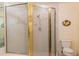 Shower includes glass doors, tiled walls, and a rainfall showerhead, enhancing the bathing experience at 11722 Currie Ln # G1, Largo, FL 33774