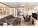 Relaxing sunroom features cozy seating, tile floors, and ample natural light at 11722 Currie Ln # G1, Largo, FL 33774