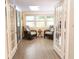 Cozy sunroom with tile floors, comfortable seating, and views of the outdoors at 11722 Currie Ln # G1, Largo, FL 33774