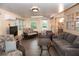 Inviting sunroom with neutral decor, comfortable seating, and tile floors at 11722 Currie Ln # G1, Largo, FL 33774
