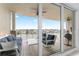 Relax on the balcony with comfortable seating and scenic waterfront views, perfect for entertaining at 125 Island Way # 402, Clearwater Beach, FL 33767