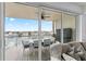 Balcony with outdoor seating, featuring views of the water and surrounding neighborhood at 125 Island Way # 402, Clearwater Beach, FL 33767