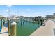 Waterfront boat dock featuring boat slips, boat lift, and easy access to the open water at 125 Island Way # 402, Clearwater Beach, FL 33767