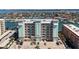 Multi-story condo building with manicured landscaping and ample parking at 125 Island Way # 402, Clearwater Beach, FL 33767
