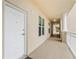 Bright hallway with neutral tones, leading to residences within a well-maintained condominium at 125 Island Way # 402, Clearwater Beach, FL 33767