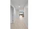 Inviting hallway leading to an open living space with scenic views and lots of natural light at 125 Island Way # 402, Clearwater Beach, FL 33767