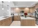 Modern kitchen boasts stainless appliances, granite countertops, and ample cabinets at 125 Island Way # 402, Clearwater Beach, FL 33767
